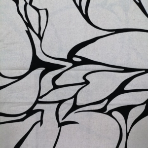 An organic, abstract print with stylized foliage and large interlocking petals; in a classic black and natural palette perfectly suited to sophisticated styling