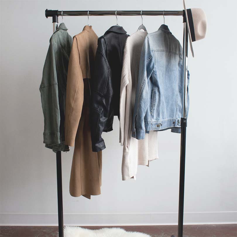 Clothing rail with 5 different jackets or coats on display.