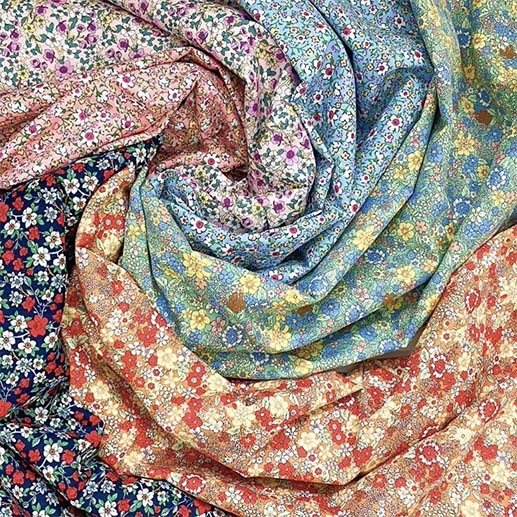 Different colour ditsy floral prints displayed in a swirl