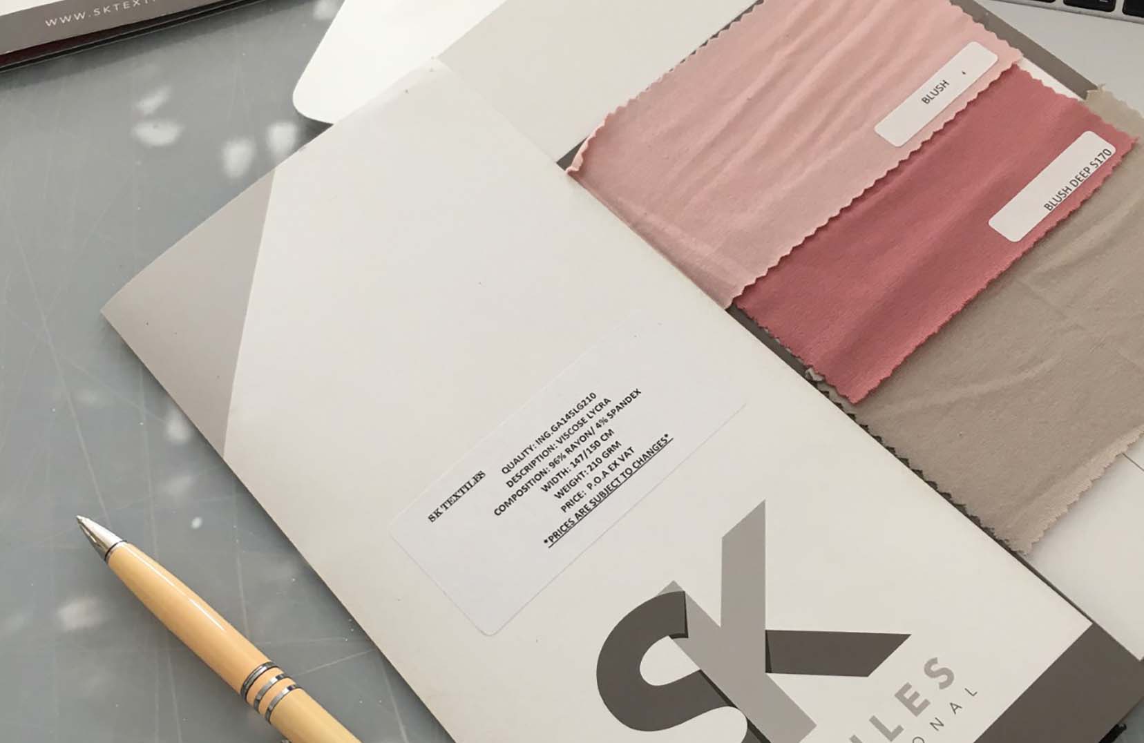 A branded card with all the different colours swatches of the same fabric for sale